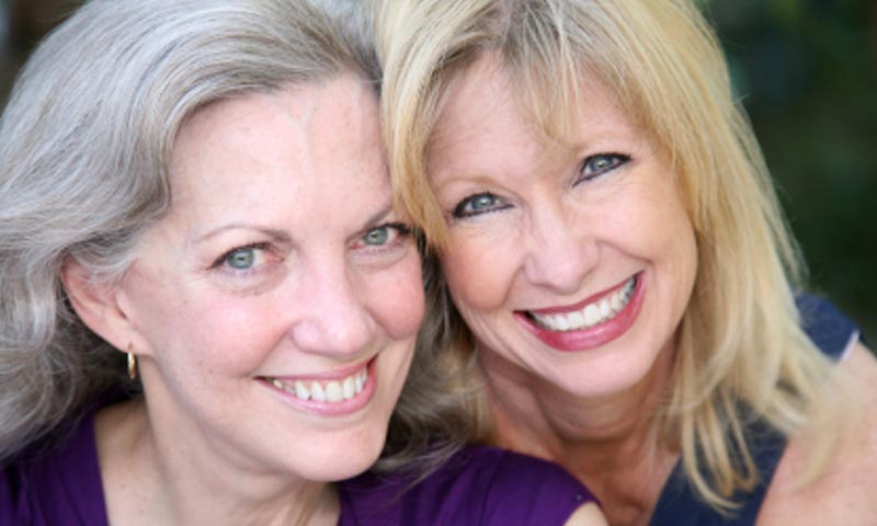 Stock-Filler-Image-home-02 Two women smiling and hugging