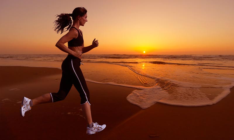 woman running on beach