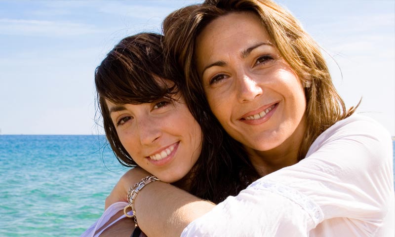 Woman and daughter on beach